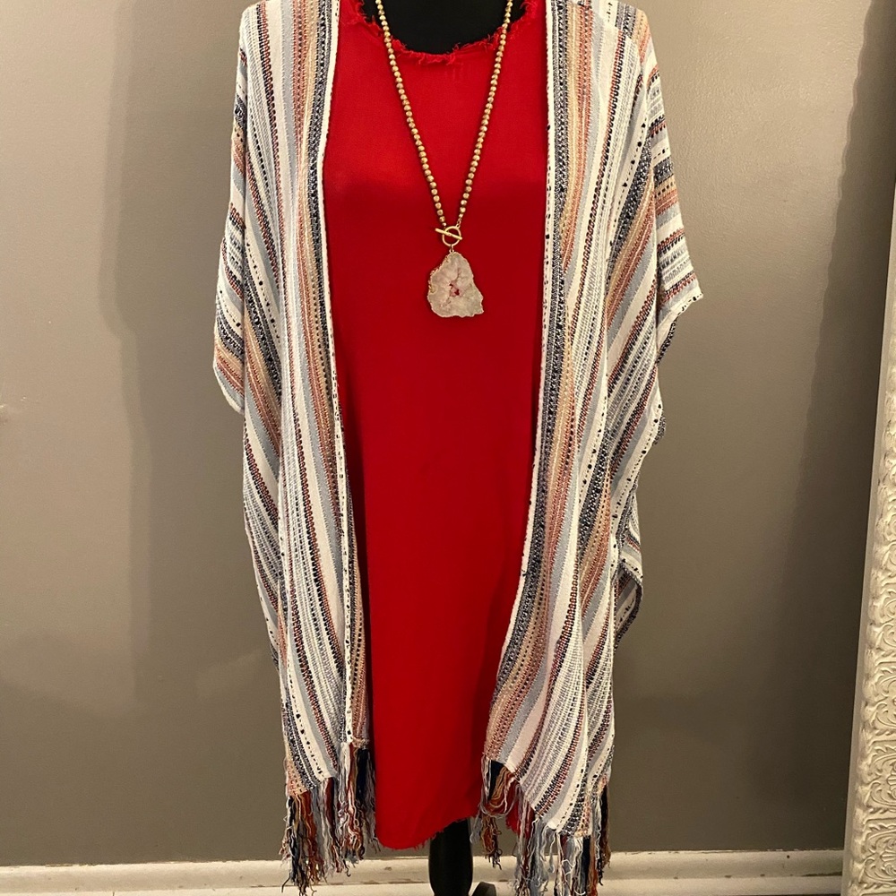 red raw-hem shift dress and striped tassel kimono